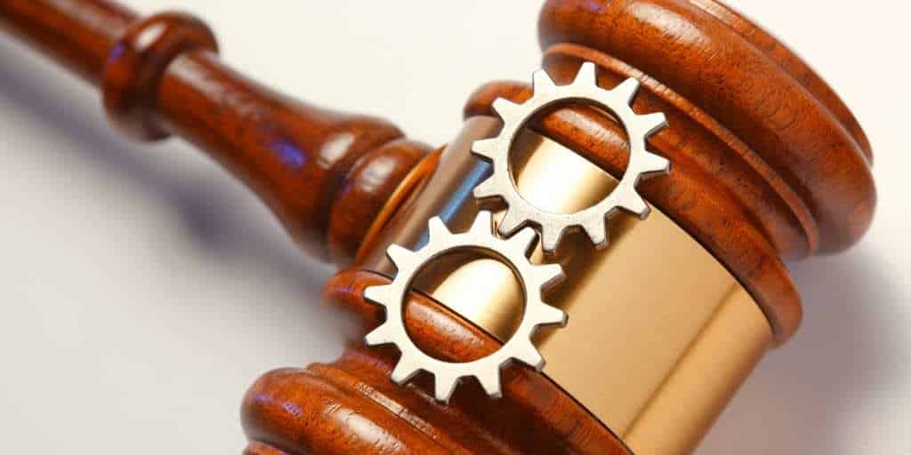 legal gavel with cogs