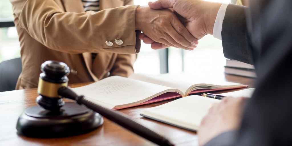 Lawyer and client shaking hands