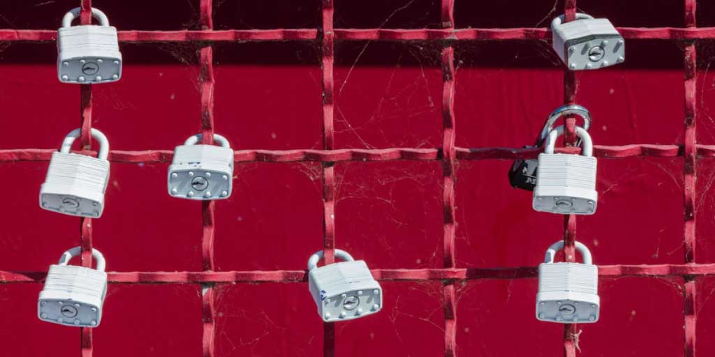 several locks on a fence